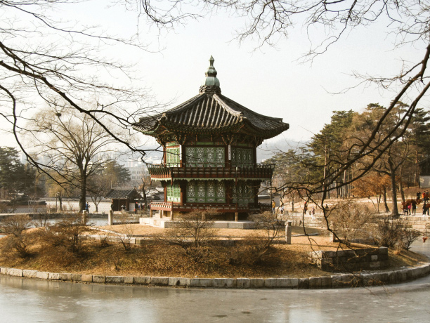 A pavilion built on an island in the center of a square pond