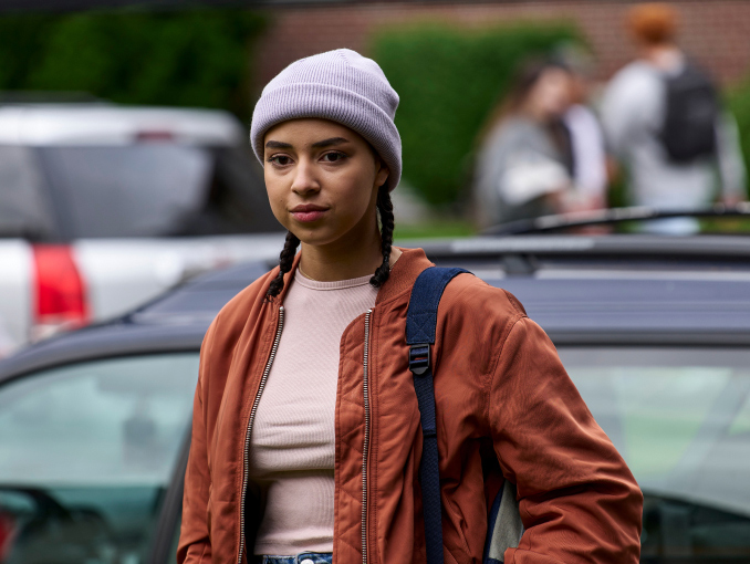 A female student in a university parking lot